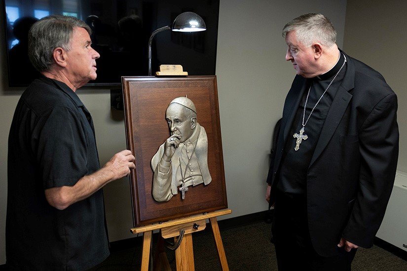 Sculptor Don Wiegand created this bas-relief sculpture of Pope Francis from a picture taken by Pat Raven as the pope was having a discussion with members of the Pontifical Academy of Sciences. Mrs. Raven’s husband, Peter, is a member of the academy.